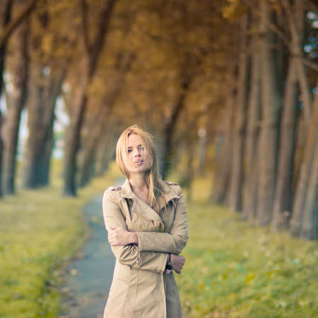beautiful girl in a dress in autumnの写真素材