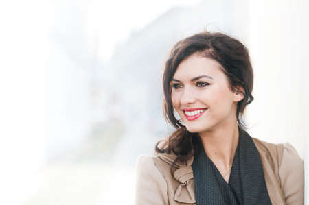 portrait of a beautiful smiling woman outdoorsの写真素材