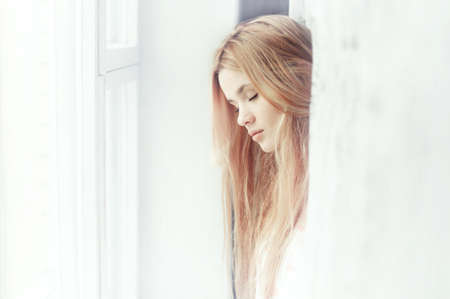 beautiful girl dreams of the windowの写真素材