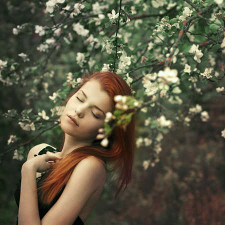 beautiful girl in the park in springの写真素材