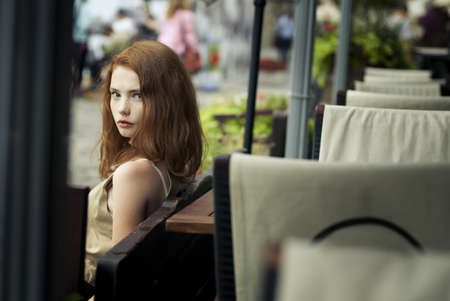 beautiful girl relaxing in the street near cafesの写真素材
