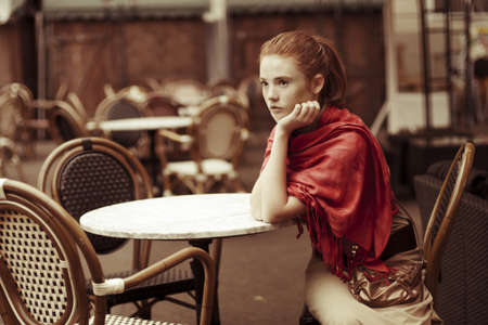 beautiful girl relaxing in the outdoor cafeの写真素材