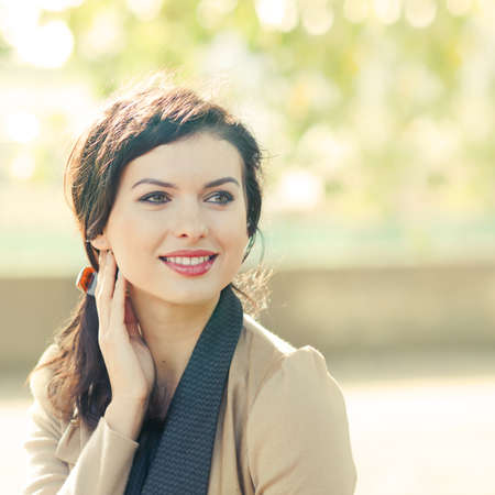 portrait of a beautiful smiling woman outdoorsの写真素材