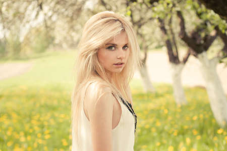 beautiful girl in the garden on a sunny dayの写真素材