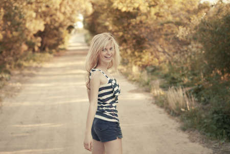 beautiful girl smiling on the roadの写真素材