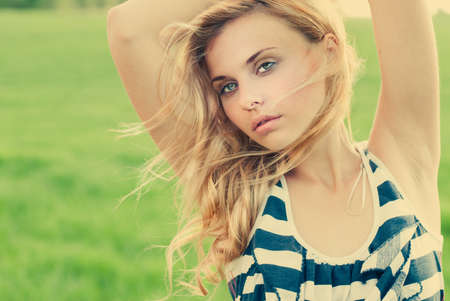 face of a beautiful blonde on a windy day の写真素材
