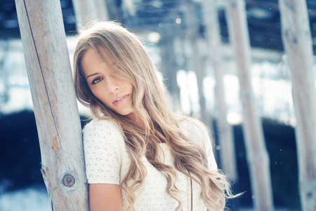 portrait of a beautiful blonde on a cold の写真素材