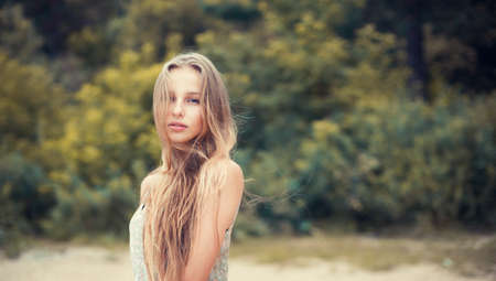 beautiful blonde outdoors in the park の写真素材