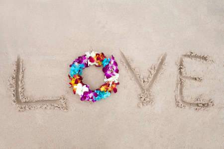 Bright flower diadem on the sandの写真素材