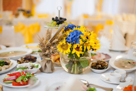 gorgeous wedding decor on table with sunflowersの写真素材