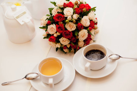 Close up of wedding bouquet with a cup of tea and coffeeの写真素材