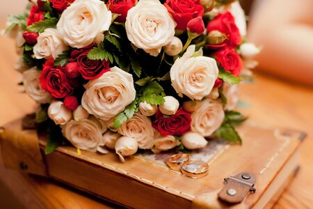 Close up of wedding ivory and red bouquetの写真素材