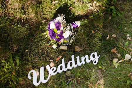 Colorful wedding bouquet with roses and gladiolus on the grassの写真素材