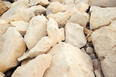 Pastel stones on the beach. Rocky coastline embankment in Limassol, Cyprus. Color image, backgroundの写真素材