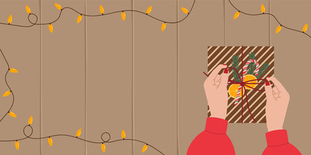 Christmas preparation concept featuring gift with women hand top view. Vector background with copy space for festive designs, holiday packaging, and seasonal promotional contentのイラスト素材