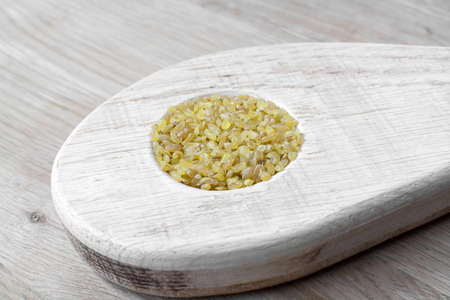 rice cereal in a round wooden mold recess