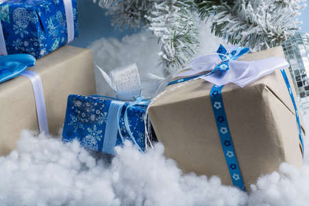 New Year's photo. the New Year's tree with imitation of snow is decorated with toys. Gifts lie under a fNew Year's tree.の写真素材