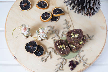 Handmade useful sweets on a wooden board. Christmas decoration. dry lemonsの写真素材