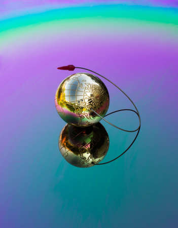 golden globe is reflected in the color mirrorの写真素材