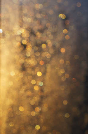 orange abstract background with sun beams and flares