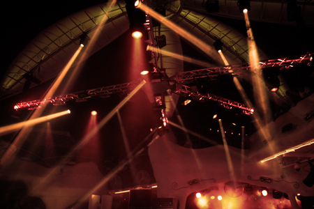 Night club dj party people enjoy of music dancing sound with colorful light with Smoke Machine and lights show. Hands up in the earth.の写真素材