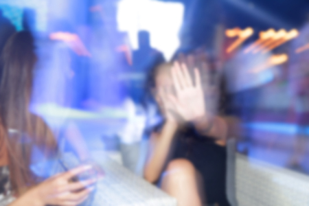 Blurry night club dj party people enjoy of music dancing sound with colorful light. club night light dj party Ibiza club. With Smoke Machine and lights. Dark background.の写真素材