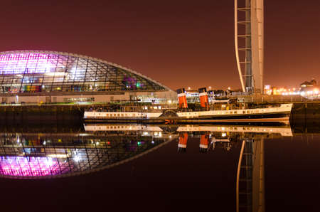 Steamboat on river Clyde by Glasgow s Science Centre at night  のeditorial素材