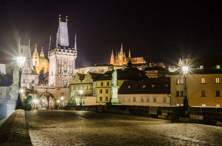Night photo of Prague s castle and Charles bridge with mist のeditorial素材
