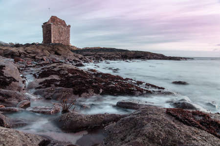 Rock shore by Portencross Castle with seaweed