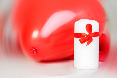 vlentines day background with red baloon heart and a candleの写真素材