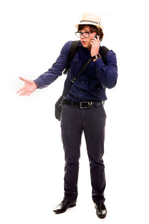 studio portrait of Man in glasses on a white background,business tourist talking on the phoneの写真素材