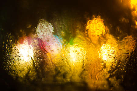 Colorful defocused bokeh lights background. City glare abstract background.の写真素材