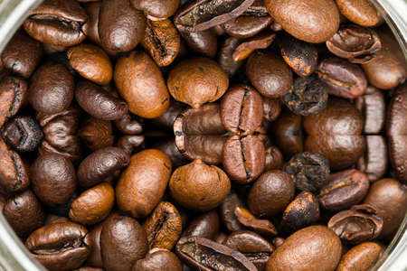 roasted coffee beans close up background textureの写真素材