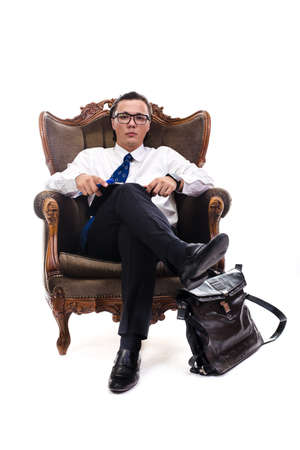 young businesman in armchair writting something, interviewer in armchair with tie,の写真素材