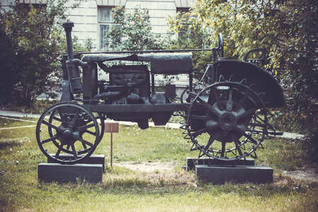 photo of rusty obsolete vintage tractor, vintage backgroundの写真素材