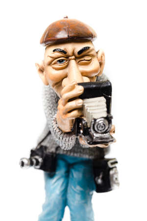 funny statuette of an old, vintage photographer with multiple cameras in operationの写真素材
