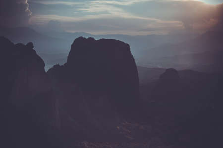 Meteors monasteries in Greece in high mountains on the sunset, background