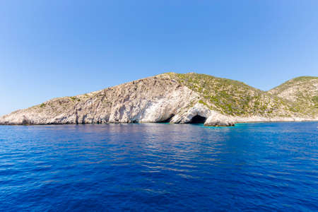 Blue sea caves on Zakynthos island, Greece, with crystal clear watersの写真素材