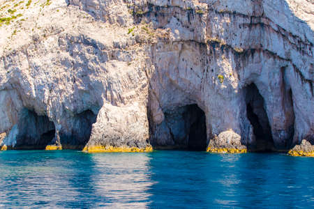 Blue sea caves on Zakynthos island, Greece, with crystal clear watersの写真素材