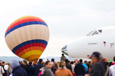 avia show 25.09.2016 Moldova. International Moldavian airport air show on the occasion of national day of Civil Aviation. People are viewing exposition planes.のeditorial素材