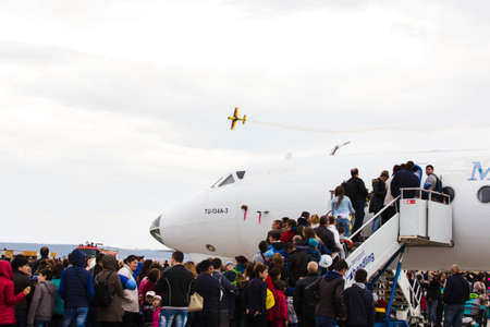 avia show 25.09.2016 Moldova. International Moldavian airport air show on the occasion of national day of Civil Aviation. People are viewing exposition planes.のeditorial素材