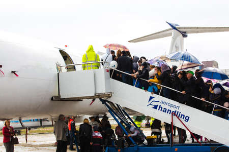 avia show 25.09.2016 Moldova. International Moldavian airport air show on the occasion of national day of Civil Aviation. People are viewing exposition planes.のeditorial素材