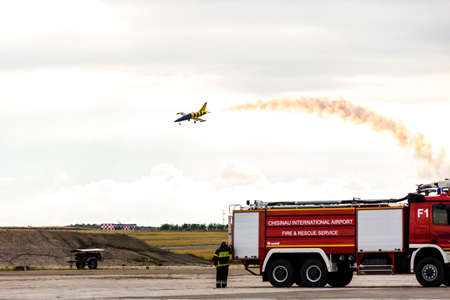 avia show 25.09.2016 Moldova. International Moldavian airport air show on the occasion of national day of Civil Aviation. Aerial acrobatics over fire engineのeditorial素材