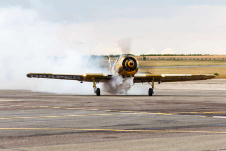 avia show 25.09.2016 Moldova. International Moldavian airport air show on the occasion of national day of Civil Aviation. aircraft landed for the spectators greeting blowing decorative  smokeのeditorial素材