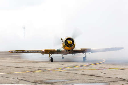avia show 25.09.2016 Moldova. International Moldavian airport air show on the occasion of national day of Civil Aviation. aircraft landed for the spectators greeting blowing decorative  smokeのeditorial素材