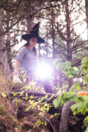 blur or defocus image of modern halloween witch in the forest
