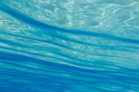 Blue underwater surface and ripples, natural scene in the ionian sea