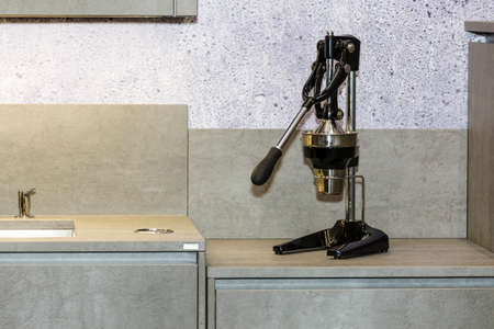 manual citrus juicer on the kitchen table