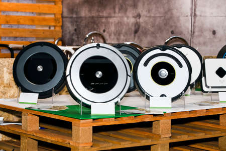 Robot vacuum cleaner on the shop stand, Smart robotic automate wireless cleaning technology machine