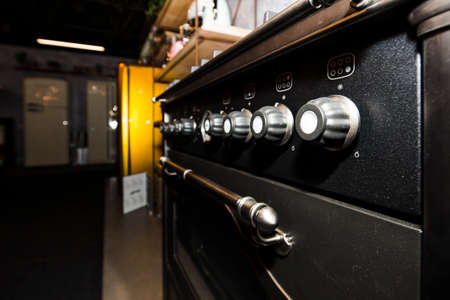 Photo of Gas cooker in a store, kitchen indoor, shallow DOF